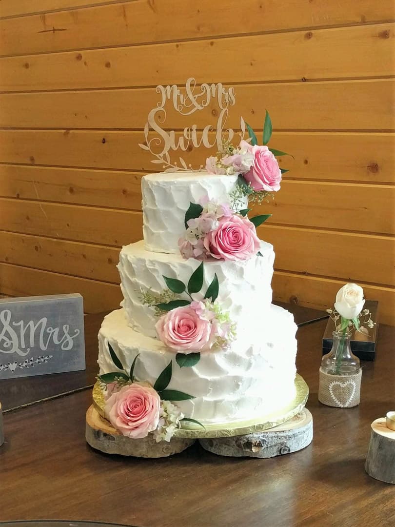 Buttercream Textured Wedding Cake WIth Pink Flowers