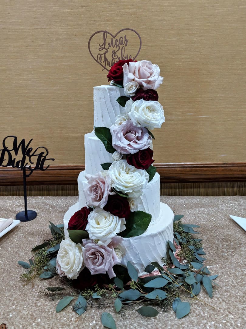 Diagonal Striped Wedding Cake With Flowers and Leaves