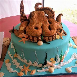 Blue-Ringed Octopus cake made entirely from scratch with funfetti cake,  vanilla buttercream, molded Rice Krispies, and marshmallow fondant. A LONG  but fun project for an invertebrate zoology class. : r/Baking