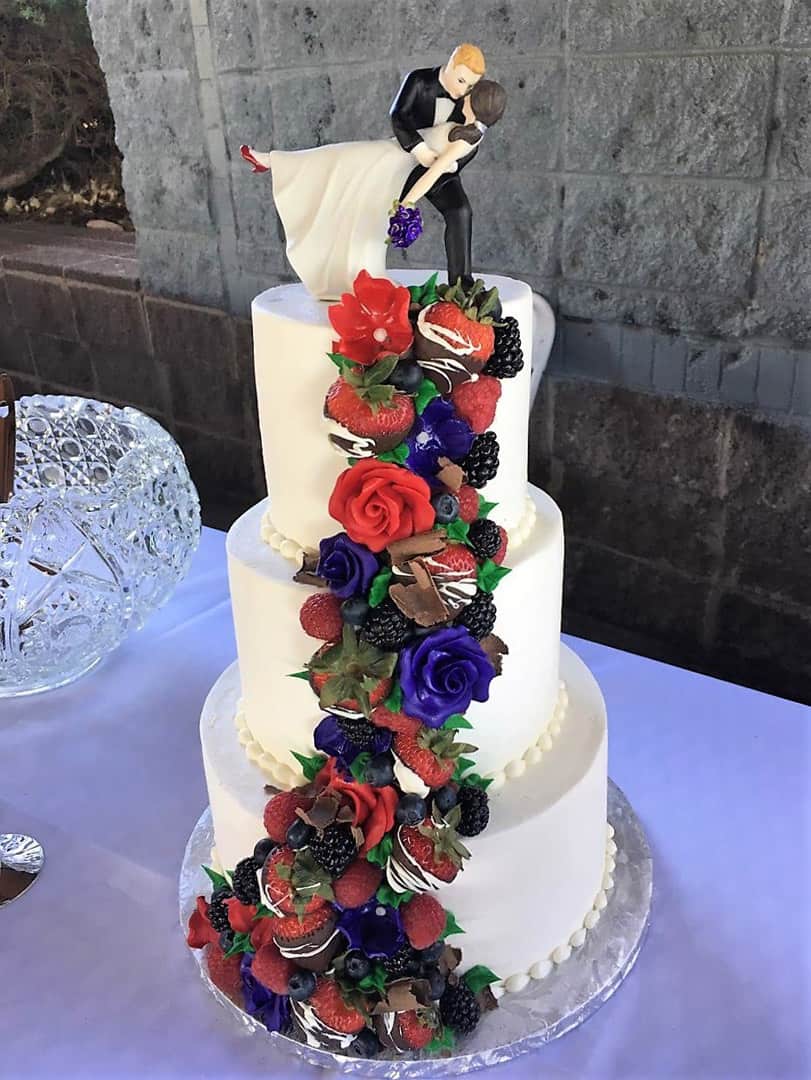 Wedding Cake With Flowers and Chocolate Covered Strawberries