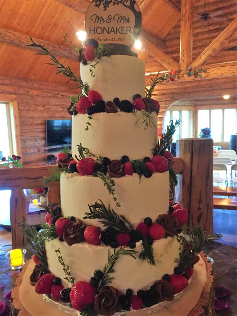 Wedding Cake With Fruit and Greenery